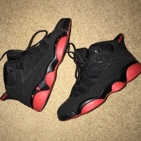 all black jordans with red